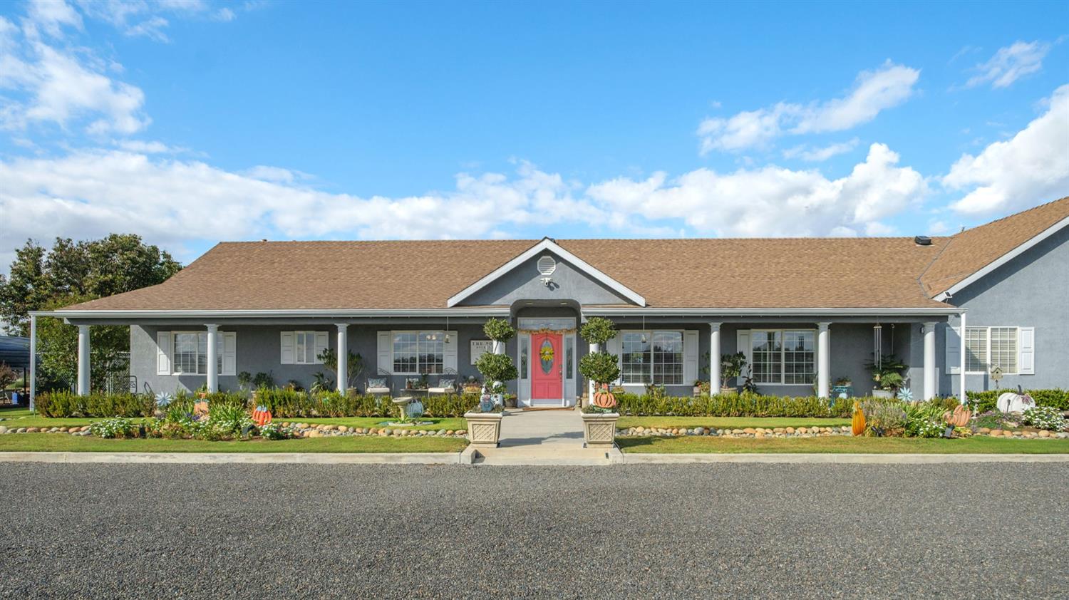 17534 West Lacey Boulevard Lemoore, CA 93245 - Photo 2 of 49 a front view of house with yard outdoor seating and barbeque oven