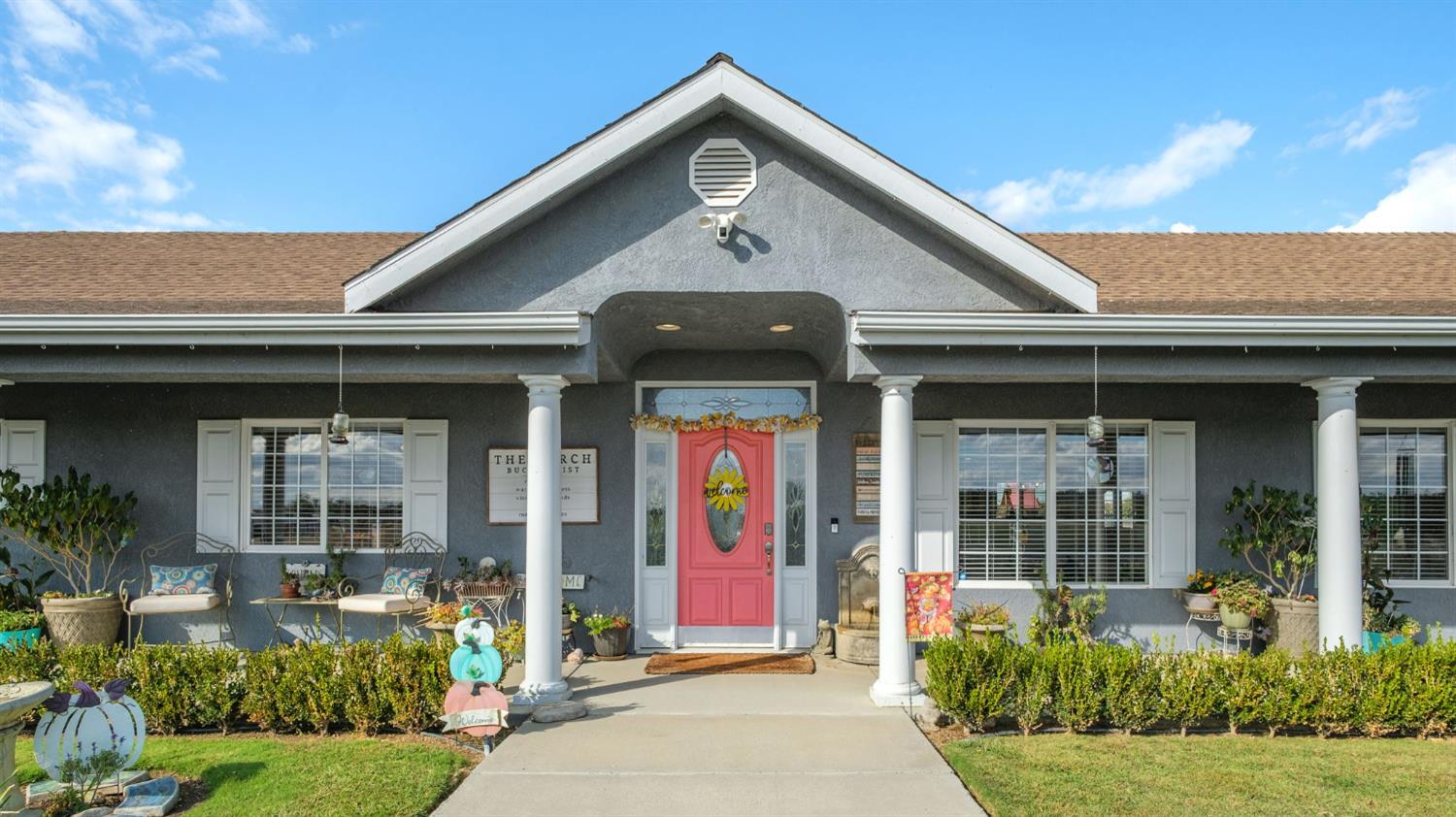 17534 West Lacey Boulevard Lemoore, CA 93245 - Photo 3 of 49 a front view of a house with garden