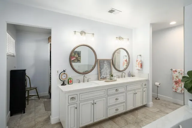 a bathroom with a sink and a bath tub