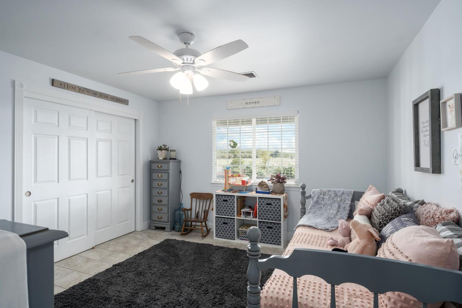 17534 West Lacey Boulevard Lemoore, CA 93245 - Photo 33 of 49 a living room with furniture and a large window
