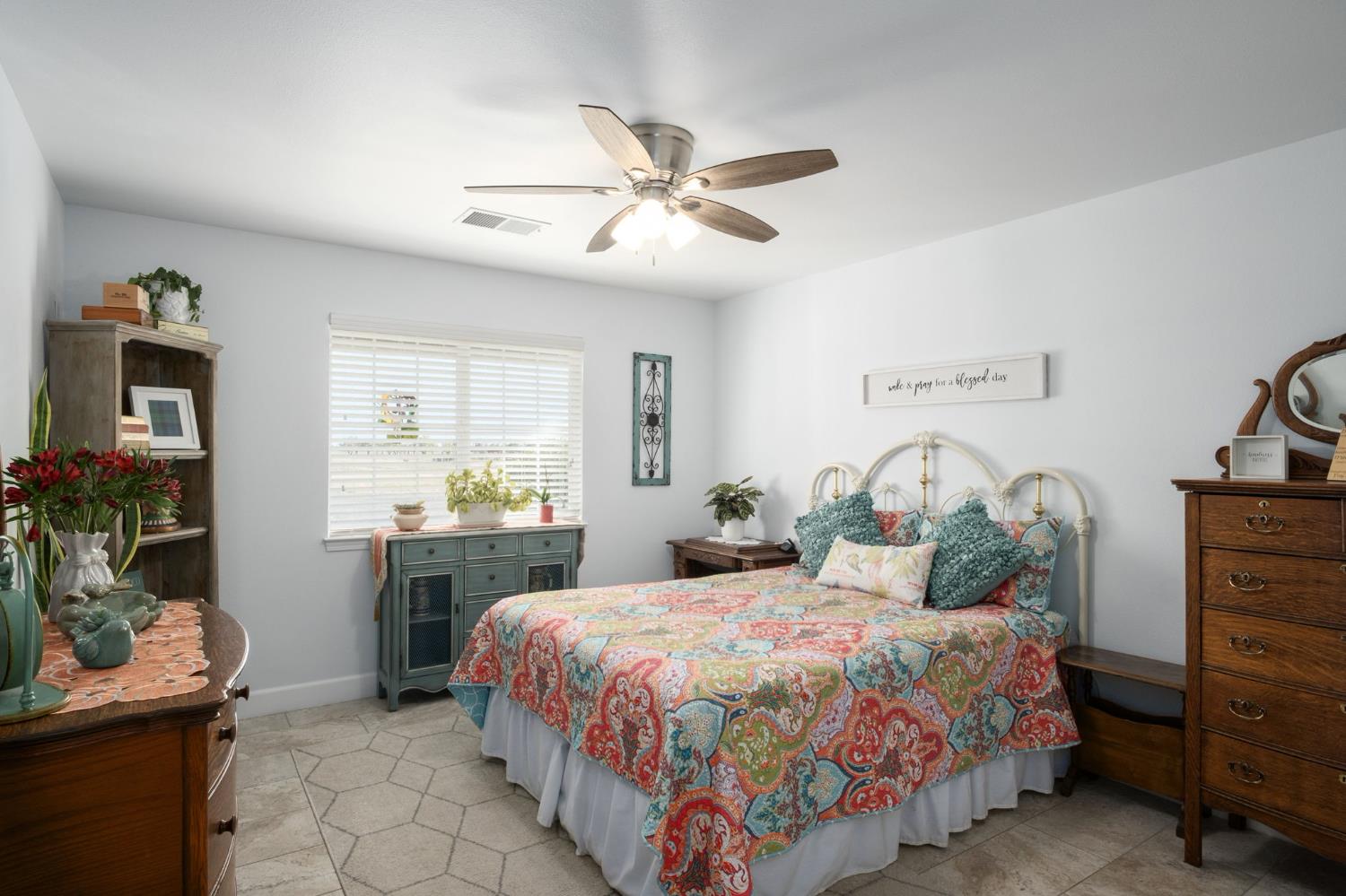 17534 West Lacey Boulevard Lemoore, CA 93245 - Photo 35 of 49 a bedroom with a bed and ceiling fan