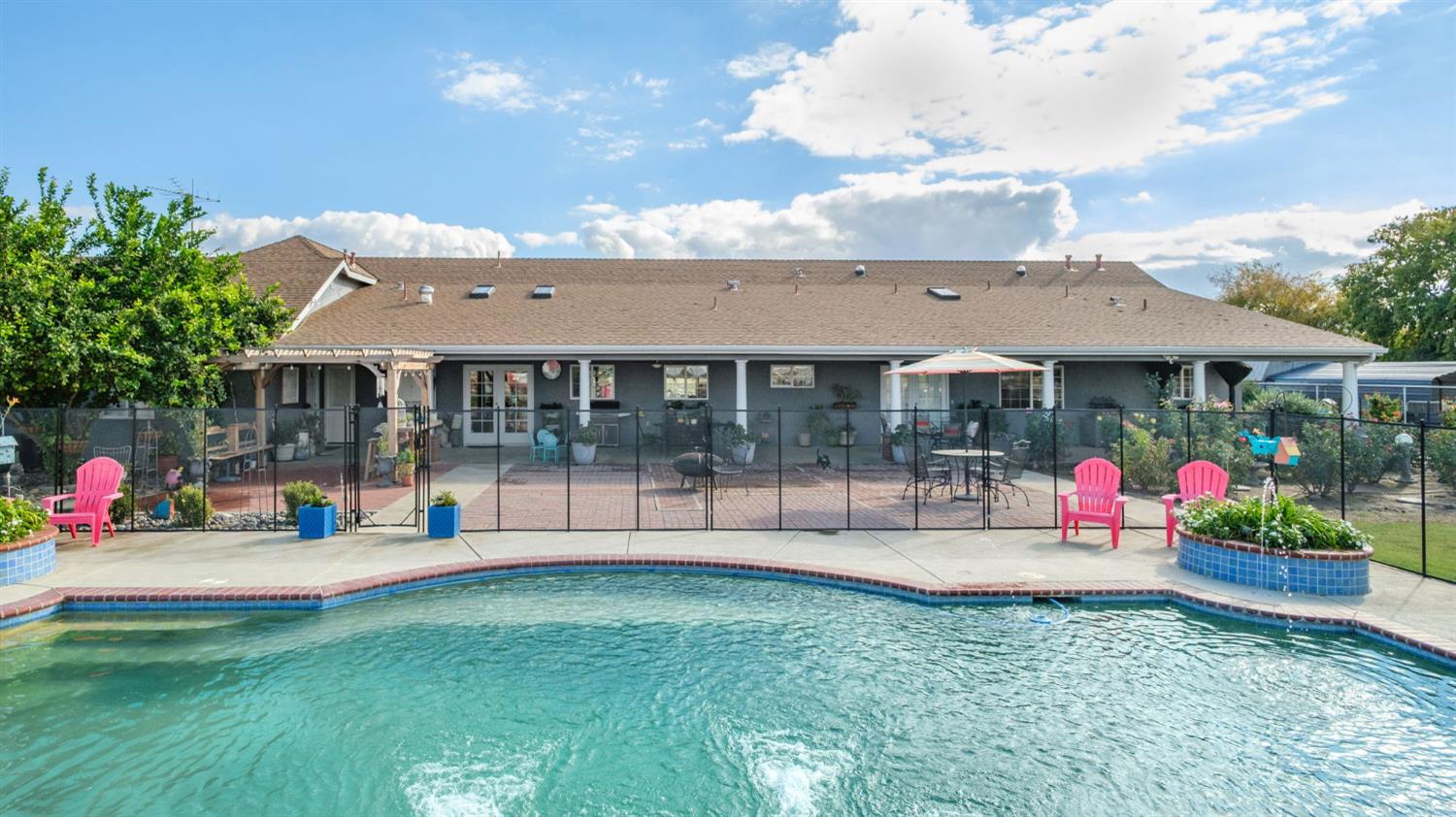 17534 West Lacey Boulevard Lemoore, CA 93245 - Photo 41 of 49 a view of outdoor space yard deck patio and swimming pool