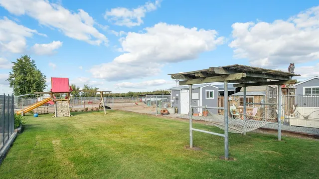 a view of a chairs and table in the patio
