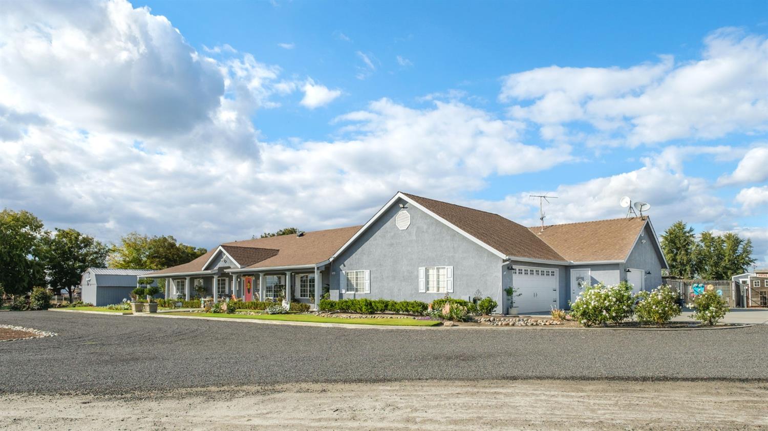 17534 West Lacey Boulevard Lemoore, CA 93245 - Photo 5 of 49 front view of a house with a street