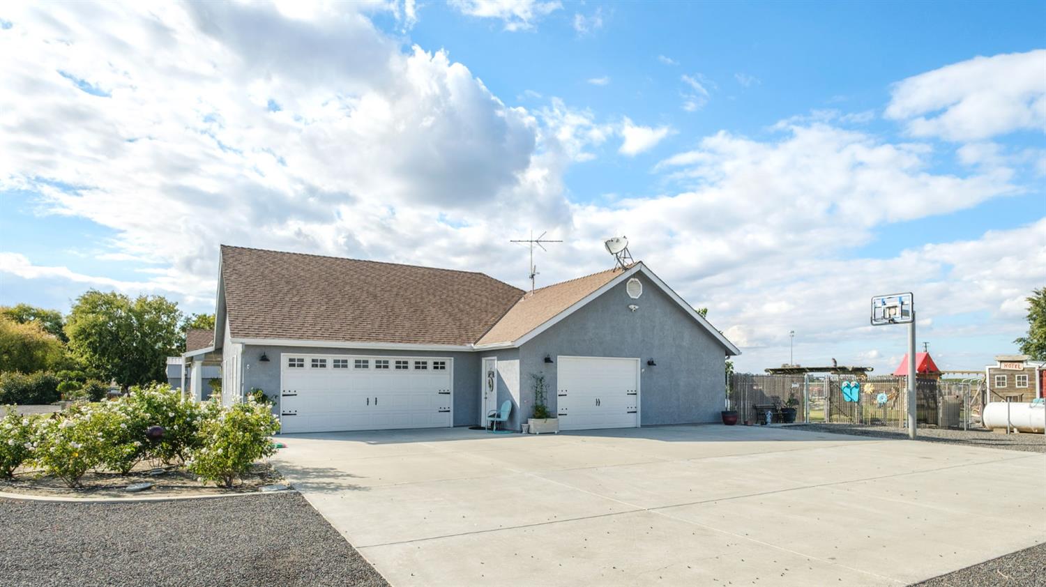 17534 West Lacey Boulevard Lemoore, CA 93245 - Photo 6 of 49 a view of house with a yard and potted plants