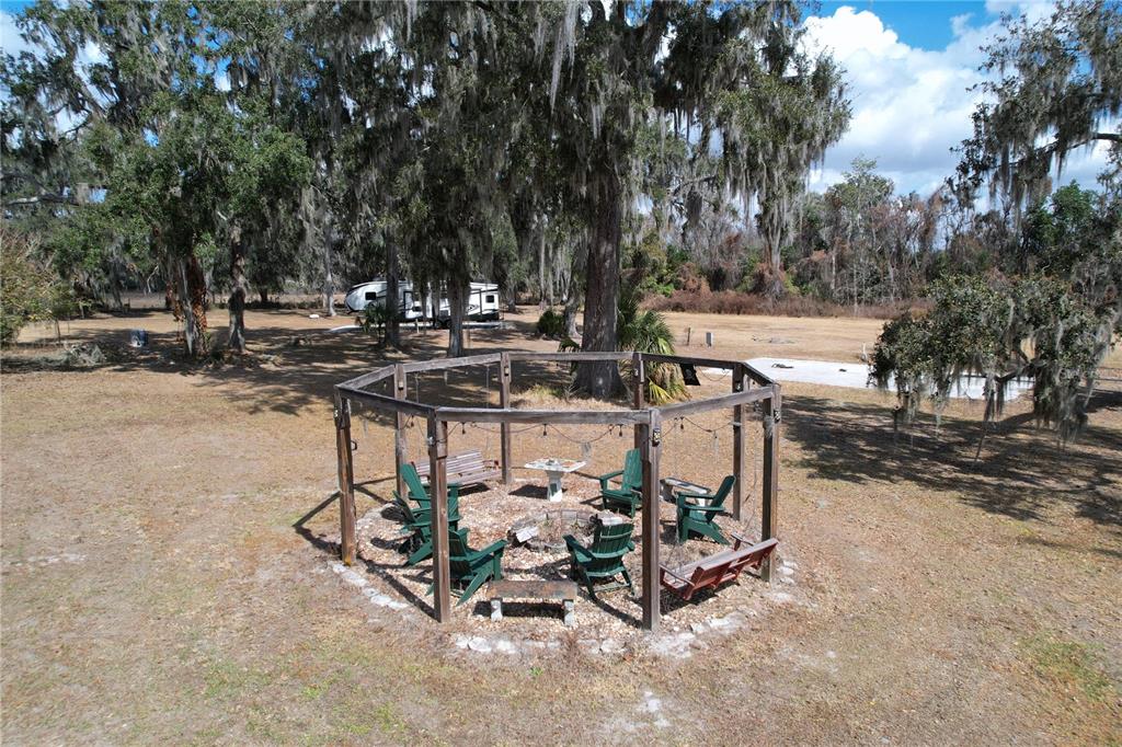 15210 Rough Diamond Ranch Road Lithia, FL 33547 - Photo 15 of 76 a view of a backyard with large trees