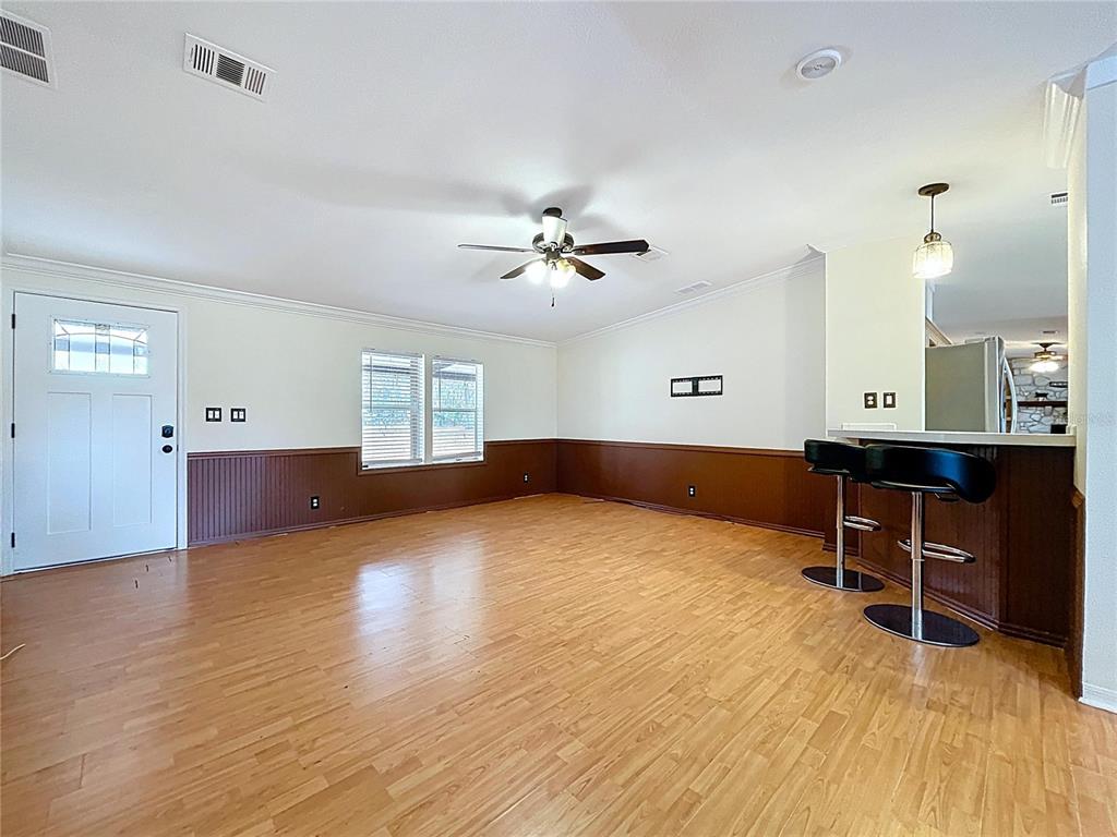 15210 Rough Diamond Ranch Road Lithia, FL 33547 - Photo 32 of 76 a view of an empty room with a window and wooden floor