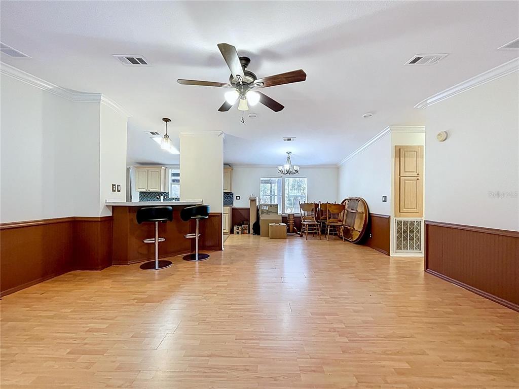 15210 Rough Diamond Ranch Road Lithia, FL 33547 - Photo 35 of 76 a living room with furniture and a dining table