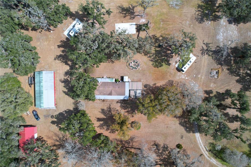 15210 Rough Diamond Ranch Road Lithia, FL 33547 - Photo 4 of 76 an aerial view of a house with a yard and trees