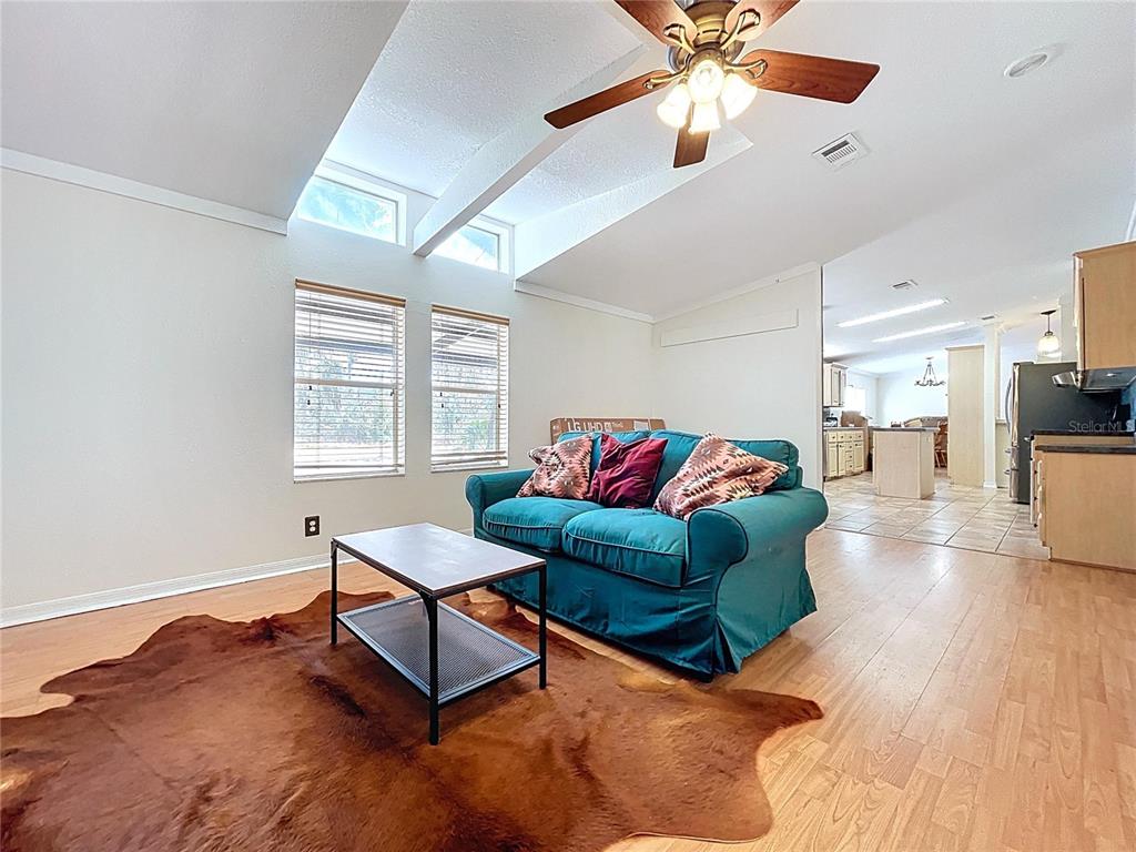 15210 Rough Diamond Ranch Road Lithia, FL 33547 - Photo 45 of 76 a living room with furniture and a wooden floor