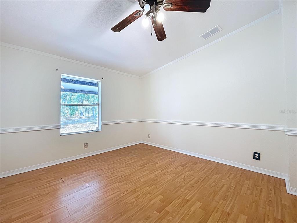 15210 Rough Diamond Ranch Road Lithia, FL 33547 - Photo 49 of 76 wooden floor in an empty room with a window
