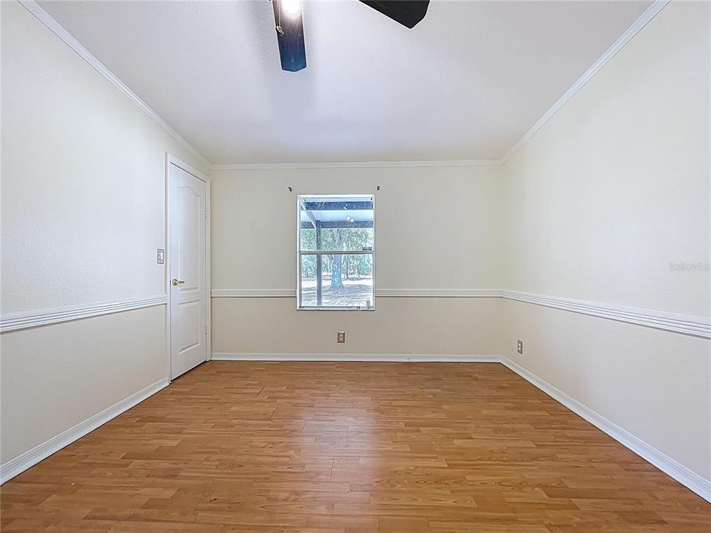 15210 Rough Diamond Ranch Road Lithia, FL 33547 - Photo 50 of 76 an empty room with a empty space and windows