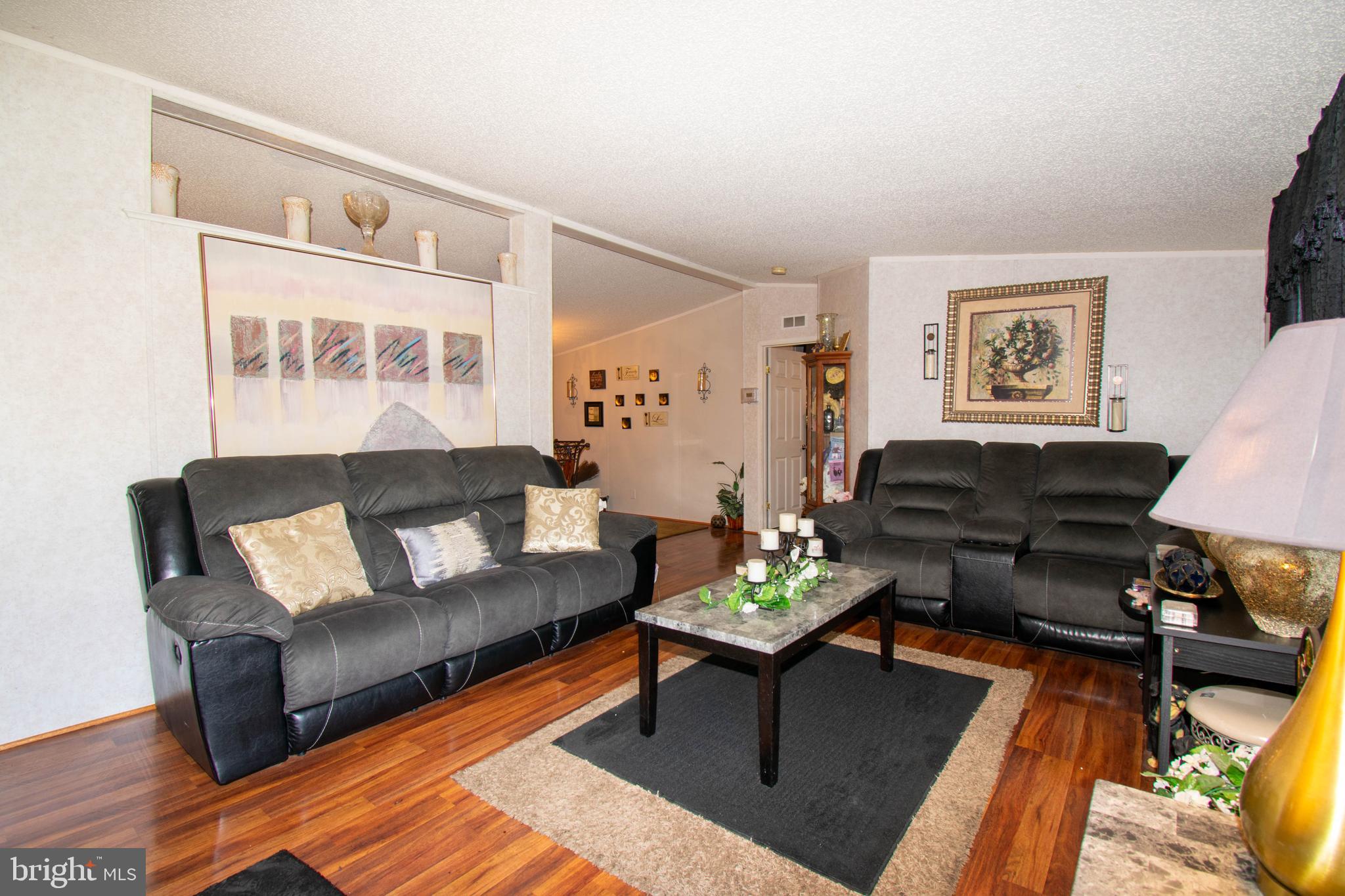 8791 Menokin Road Montross, VA 22520 - Photo 13 of 37 a living room with furniture and a rug