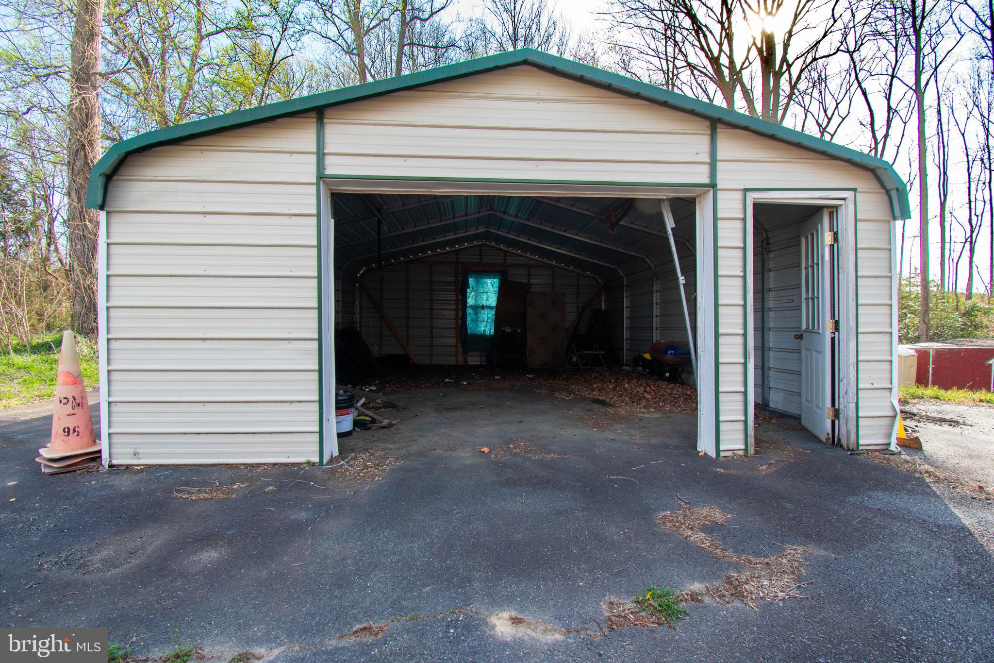 8791 Menokin Road Montross, VA 22520 - Photo 8 of 37 a view of a house with a garage