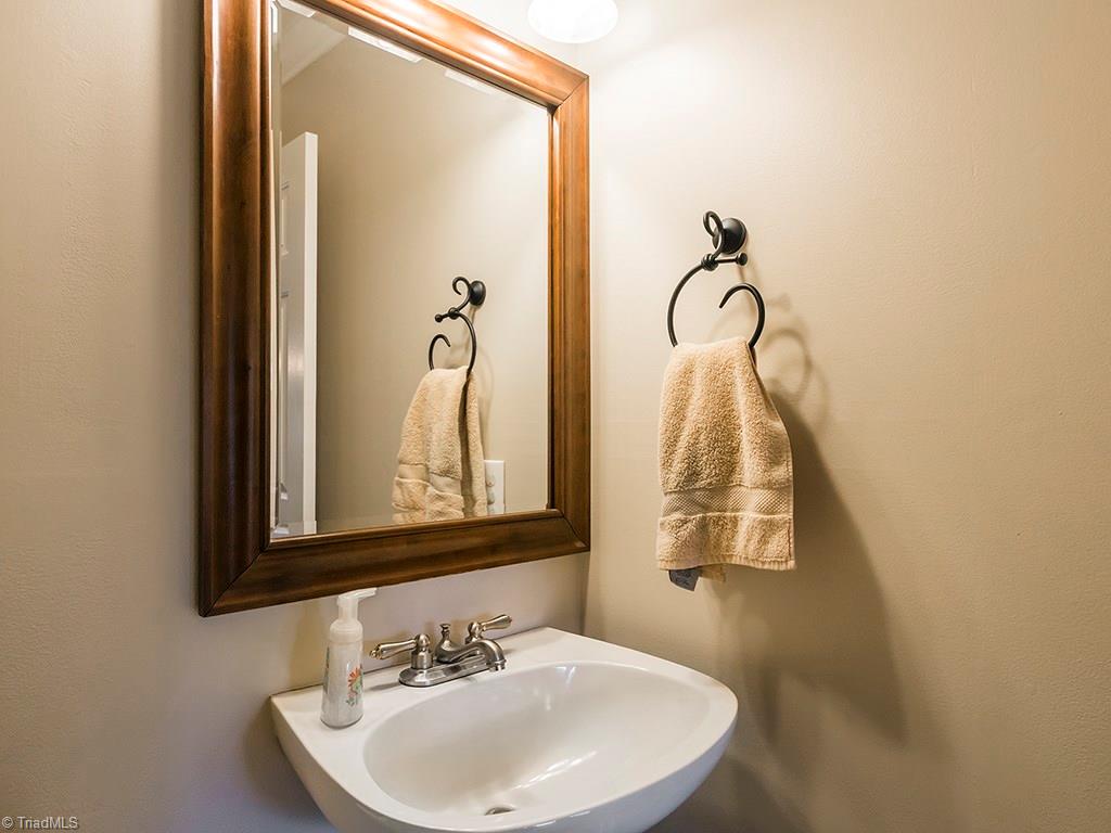 3101 Spring Mill Road Greensboro, NC 27406 - Photo 24 of 30 Updated half bath off of the kitchen.