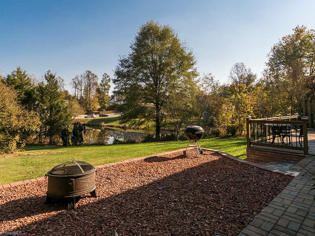 3101 Spring Mill Road Greensboro, NC 27406 - Photo 25 of 30 Fire pit area, adding more to this backyard's look and use!