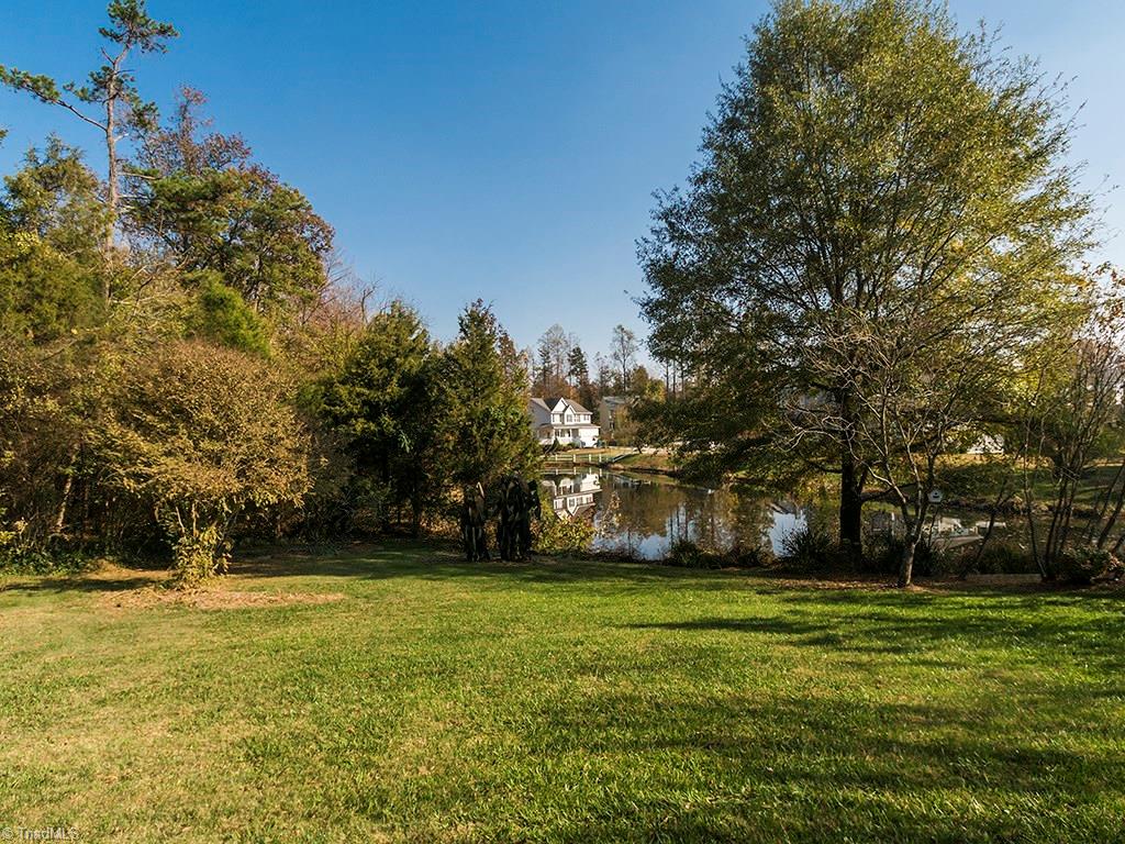 3101 Spring Mill Road Greensboro, NC 27406 - Photo 26 of 30 Flat backyard! Pond gives more privacy as you can see - no close neighbors to the rear of your lot!