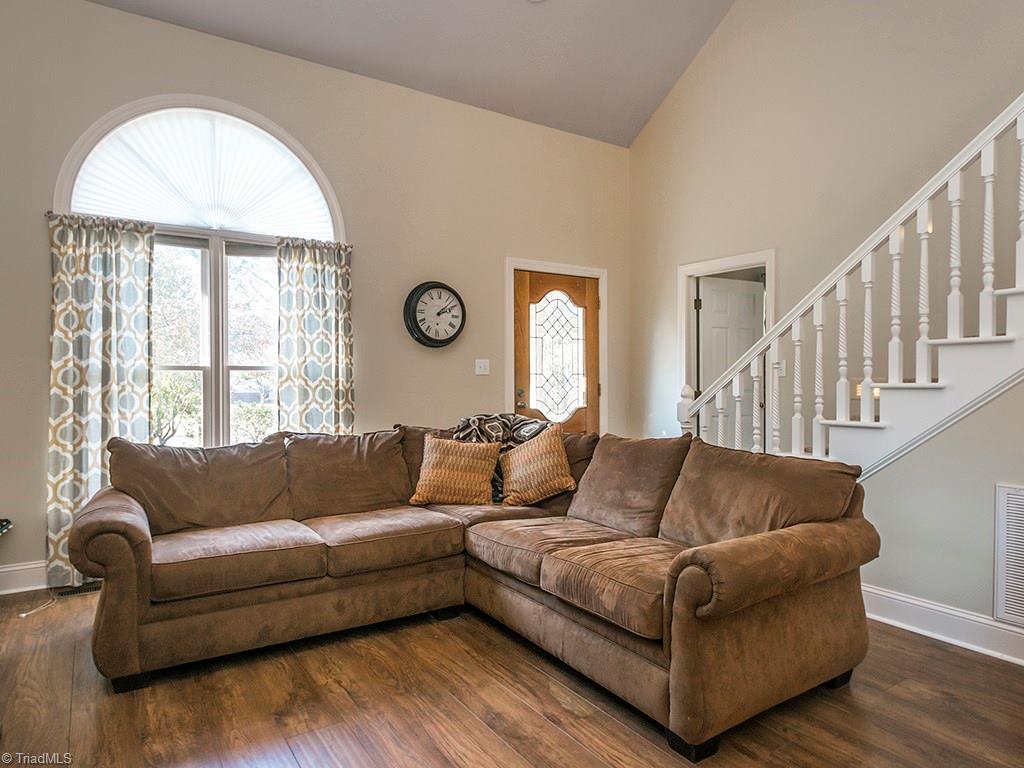 3101 Spring Mill Road Greensboro, NC 27406 - Photo 6 of 30 A look at the entry. The door in this picture is the door to the 1st floor bedroom which is currently being used as an office. Great location for a guest bedroom or home office.