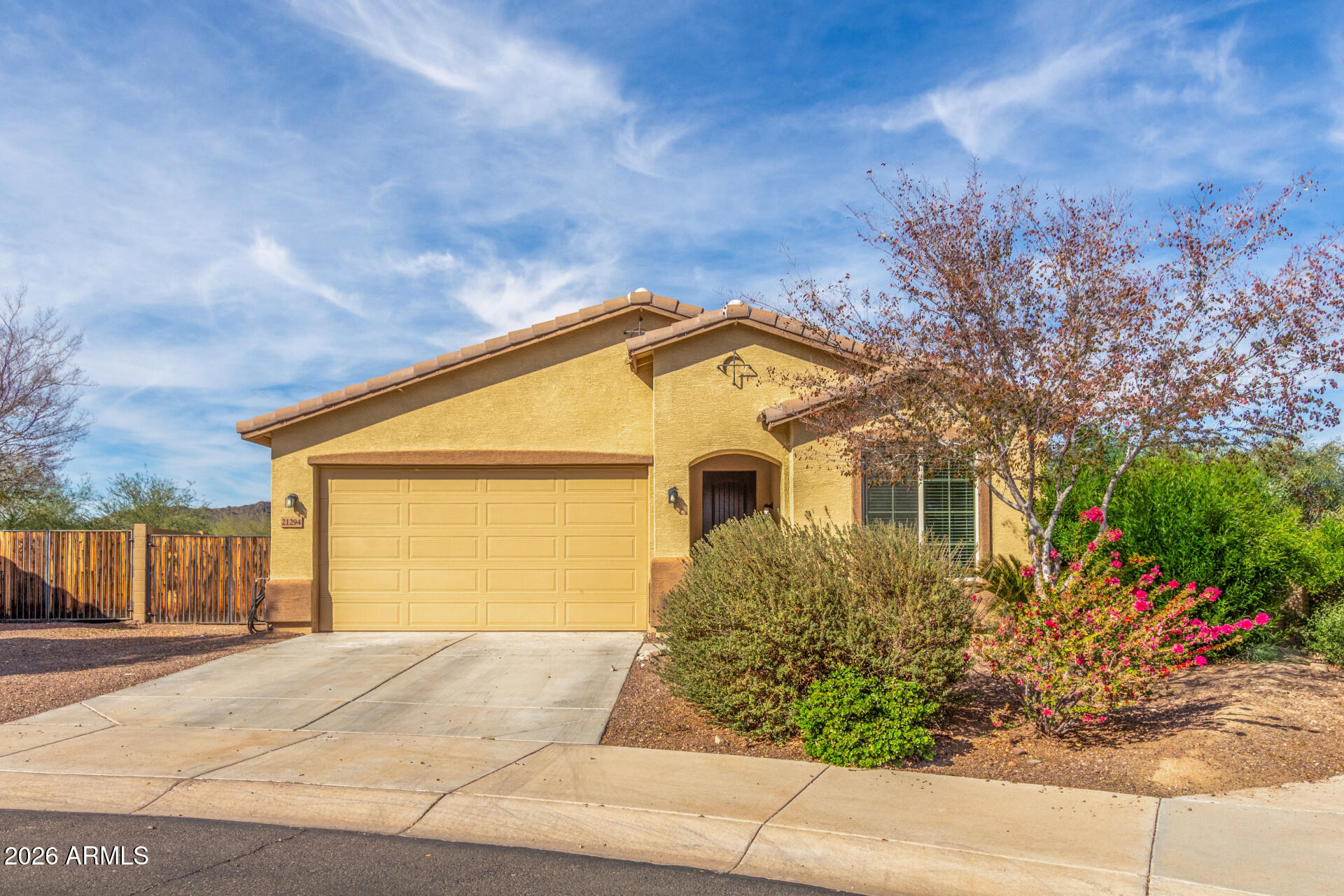 a front view of house along with trees