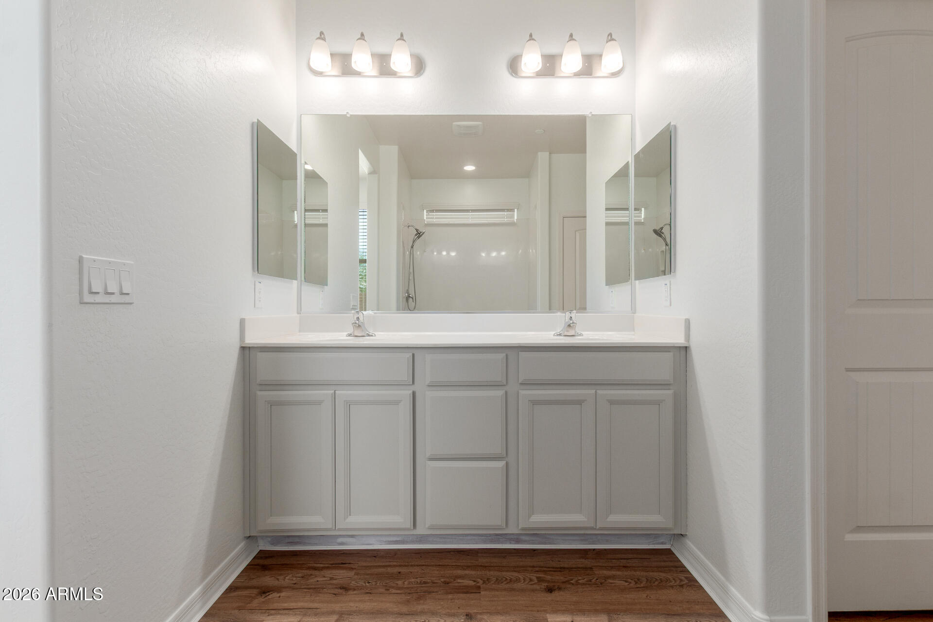 21294 West Berkeley Road Buckeye, AZ 85396 - Photo 16 of 34 a bathroom with a sink vanity and mirror