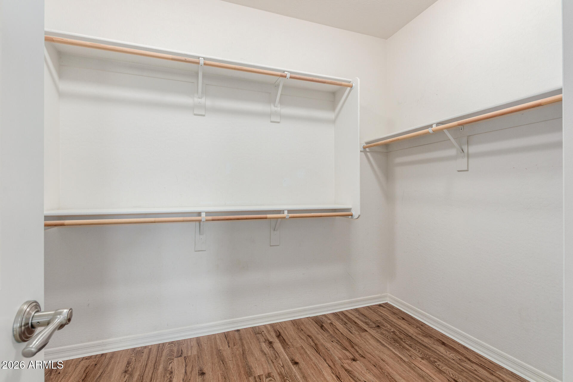 21294 West Berkeley Road Buckeye, AZ 85396 - Photo 18 of 34 a view of an empty walk in closet