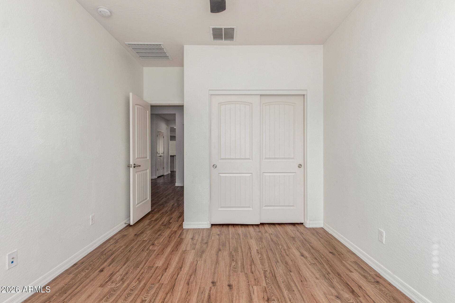 21294 West Berkeley Road Buckeye, AZ 85396 - Photo 20 of 34 a view of a hallway with wooden floor