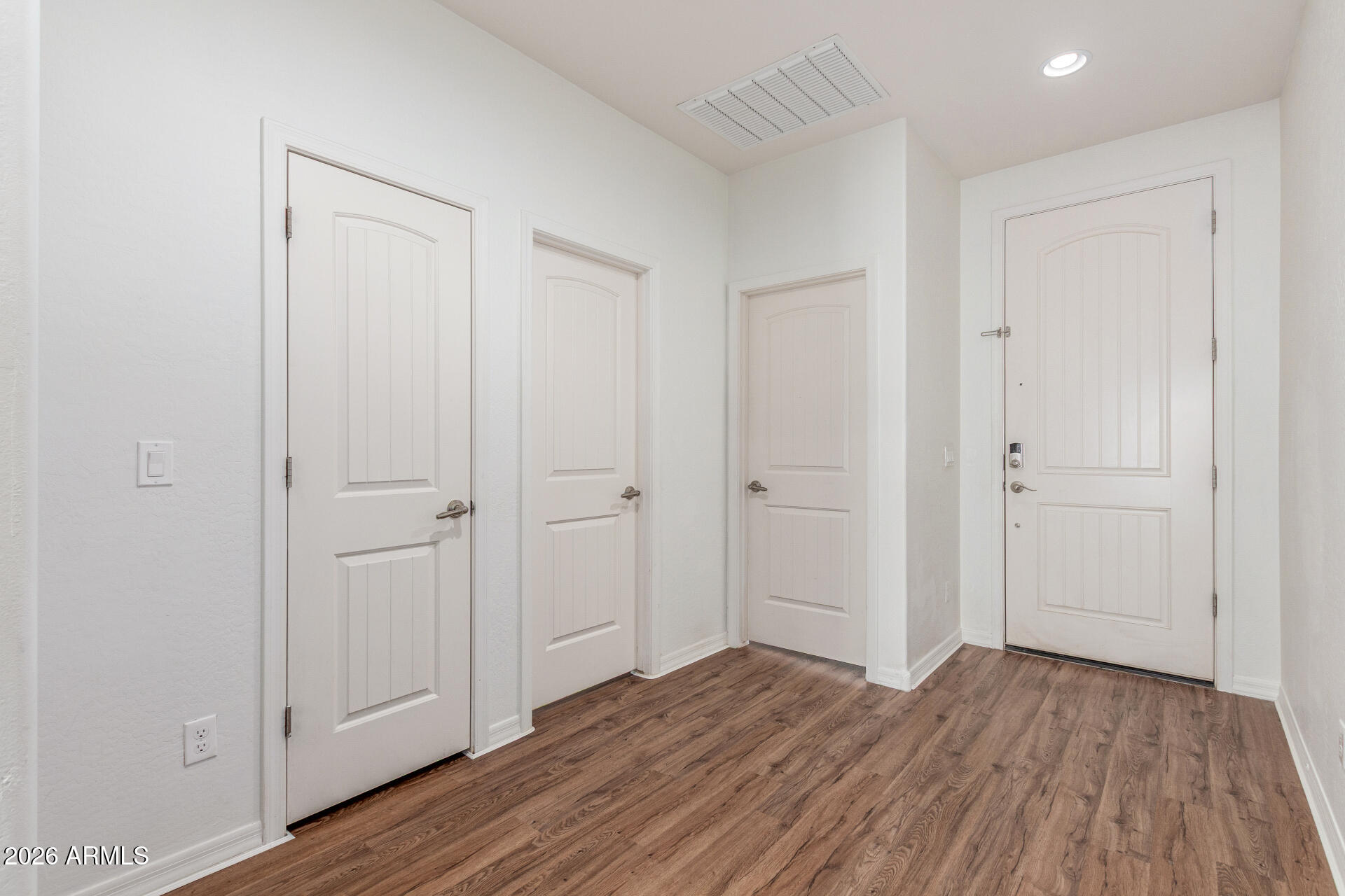 21294 West Berkeley Road Buckeye, AZ 85396 - Photo 23 of 34 a view of empty room with wooden floor