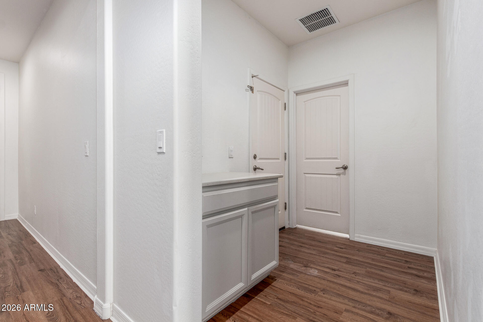 21294 West Berkeley Road Buckeye, AZ 85396 - Photo 27 of 34 a view of cabinets and wooden floor