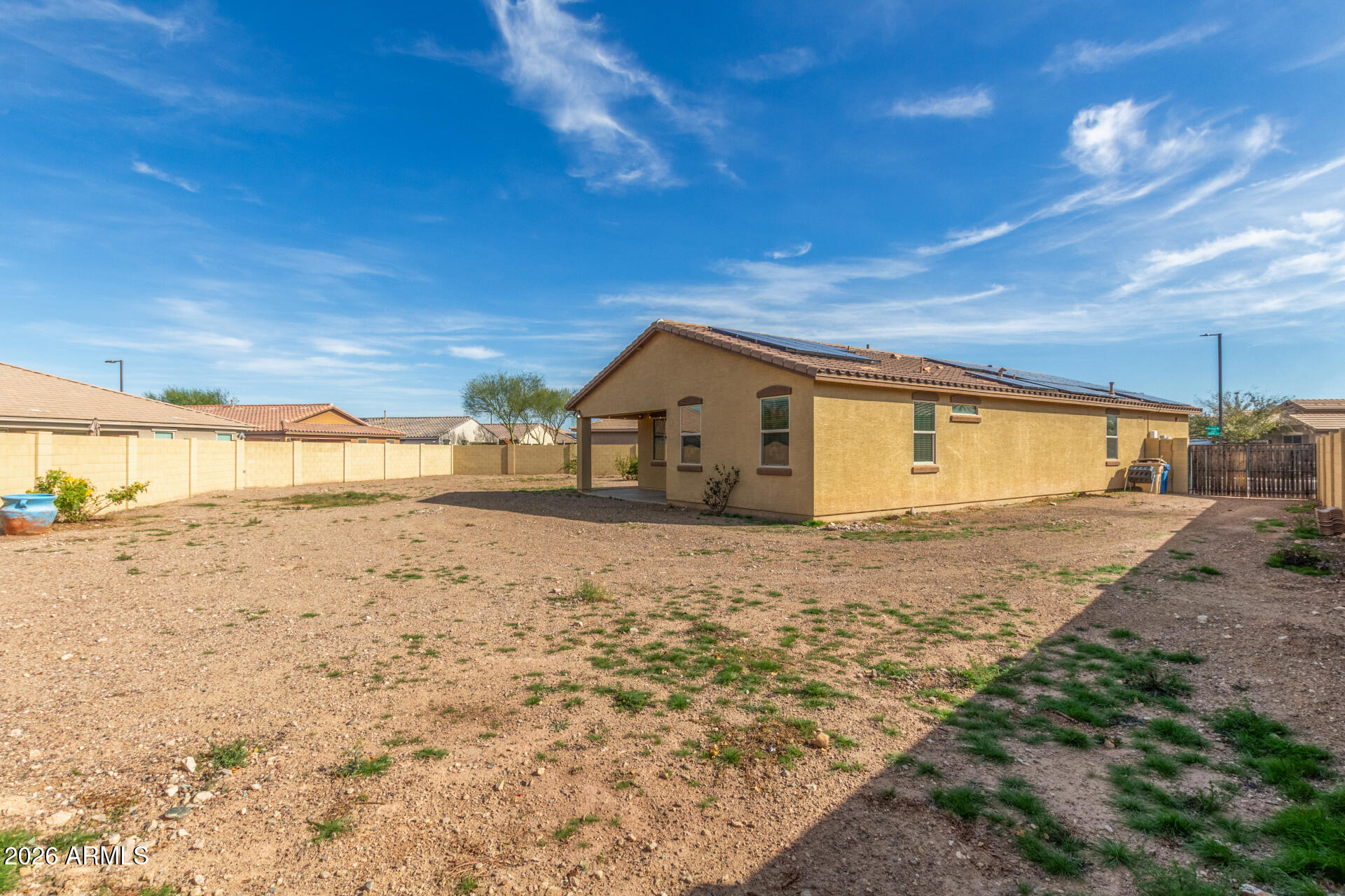 21294 West Berkeley Road Buckeye, AZ 85396 - Photo 34 of 34 a big room with wooden fence