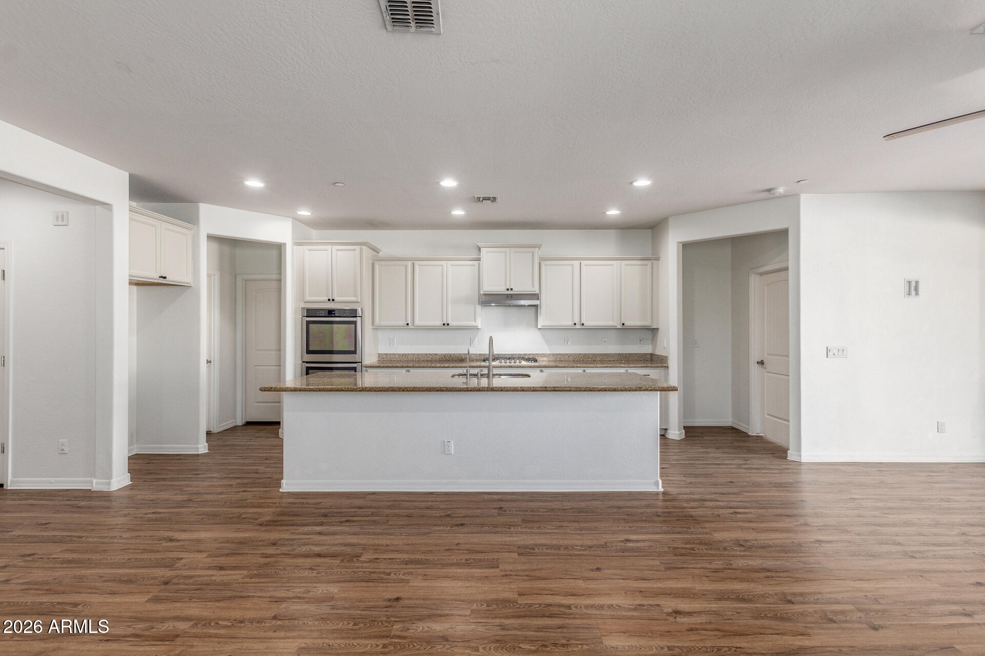 21294 West Berkeley Road Buckeye, AZ 85396 - Photo 8 of 34 a view of kitchen with wooden floor