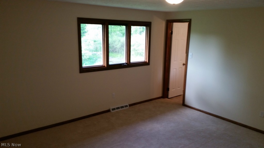 5073 Wayne Road Mantua, OH 44255 - Photo 17 of 25 Master bedroom with private bathroom