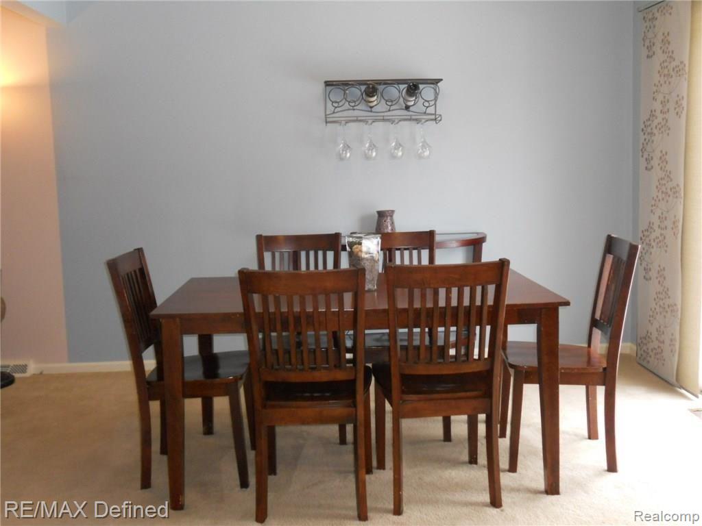 747 Cardinal Court Howell, MI 48843 - Photo 4 of 25 Dining area with doorwall to deck