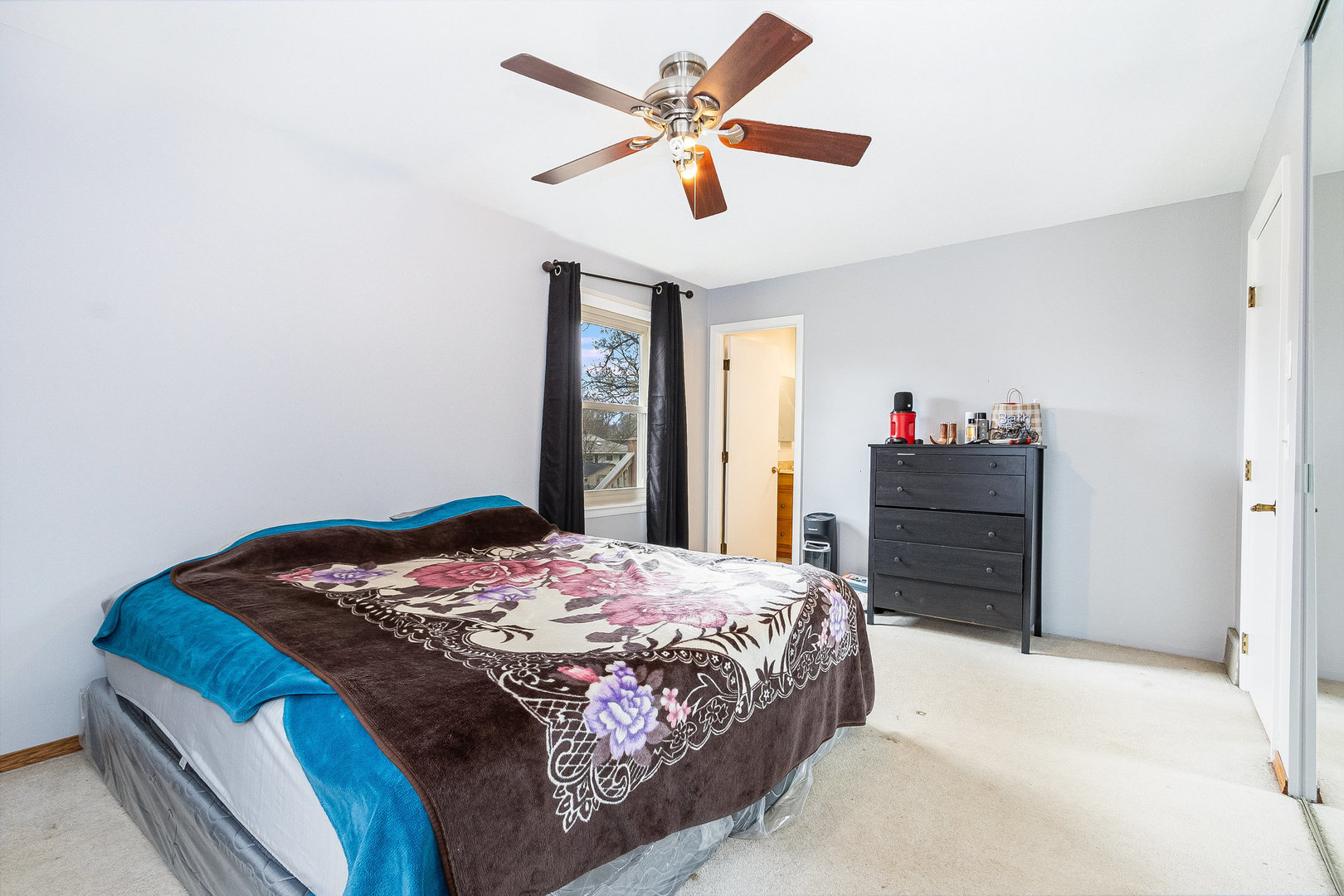 36 Field Point Road Montgomery, IL 60538 - Photo 14 of 28 a bedroom with a bed and a chandelier