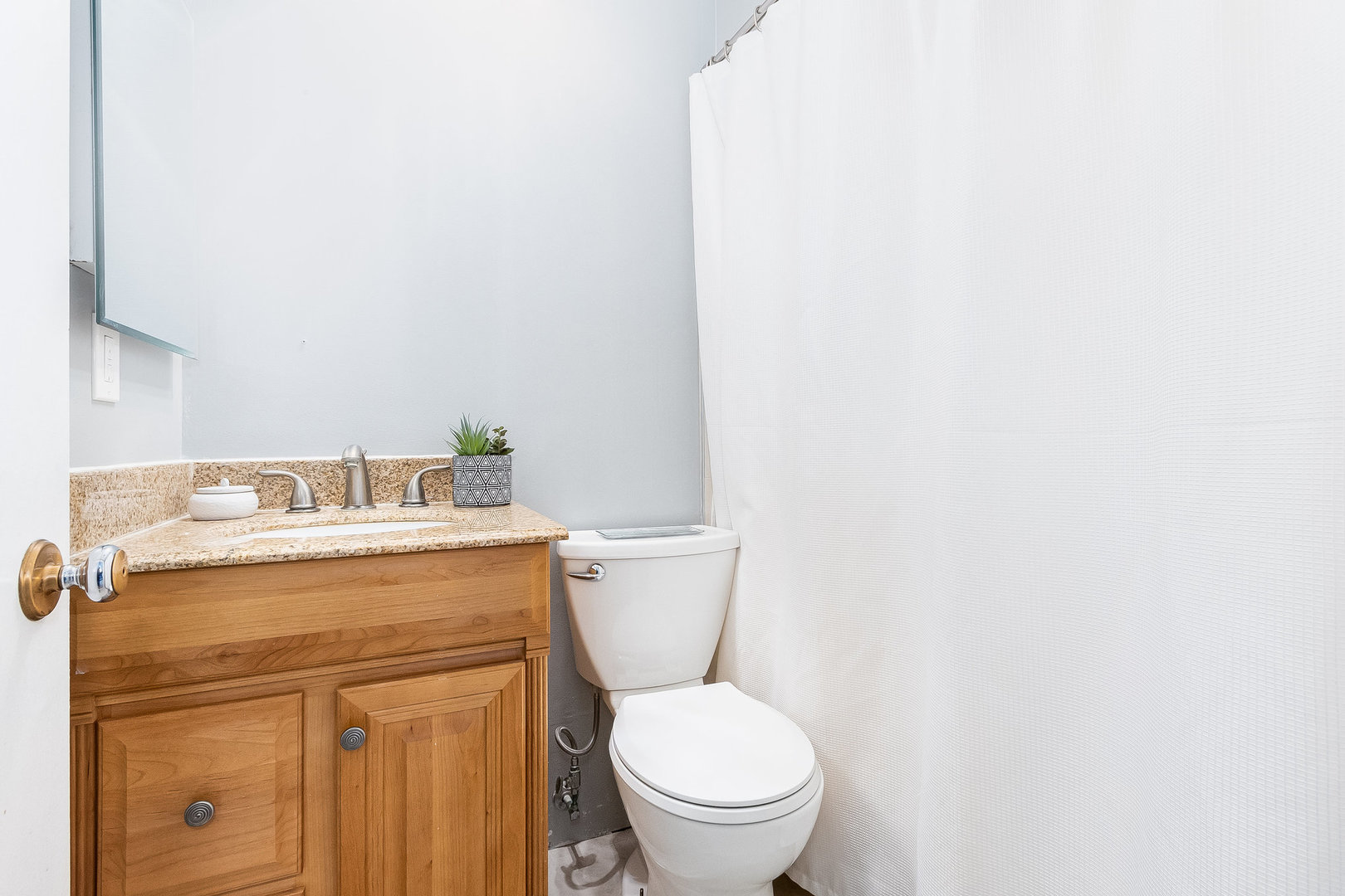 36 Field Point Road Montgomery, IL 60538 - Photo 16 of 28 a white toilet sitting next to a bathroom sink