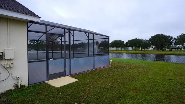 a view of a backyard with a lake view and mountain view