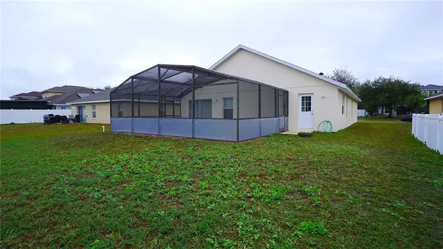 a view of a lake with houses in the back