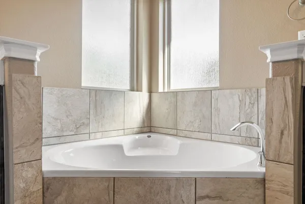 a bathroom with a sink and a large mirror