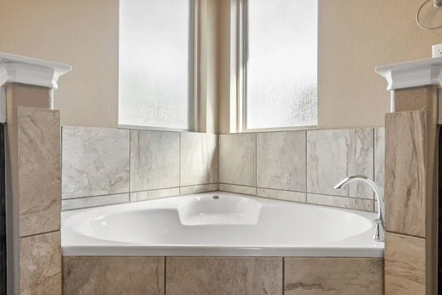 a bathroom with a sink and a large mirror