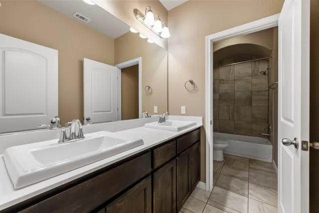 a bathroom with a toilet and a bathtub