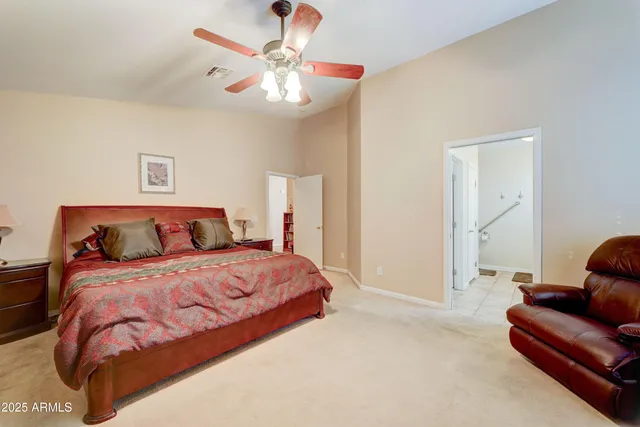 a bedroom with bed and window