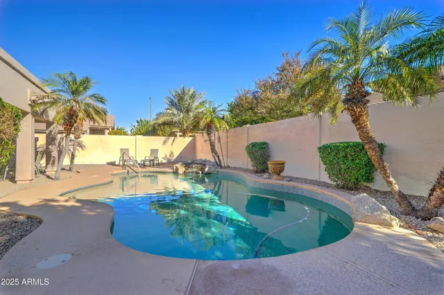 a view of a swimming pool with a patio