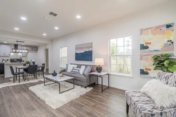 a living room with furniture and a window