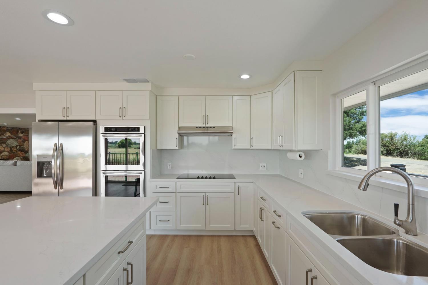 2650 West Twitchell Island Road Rio Vista, CA 94571 - Photo 30 of 60 a kitchen with a sink cabinets a counter top space and stainless steel appliances