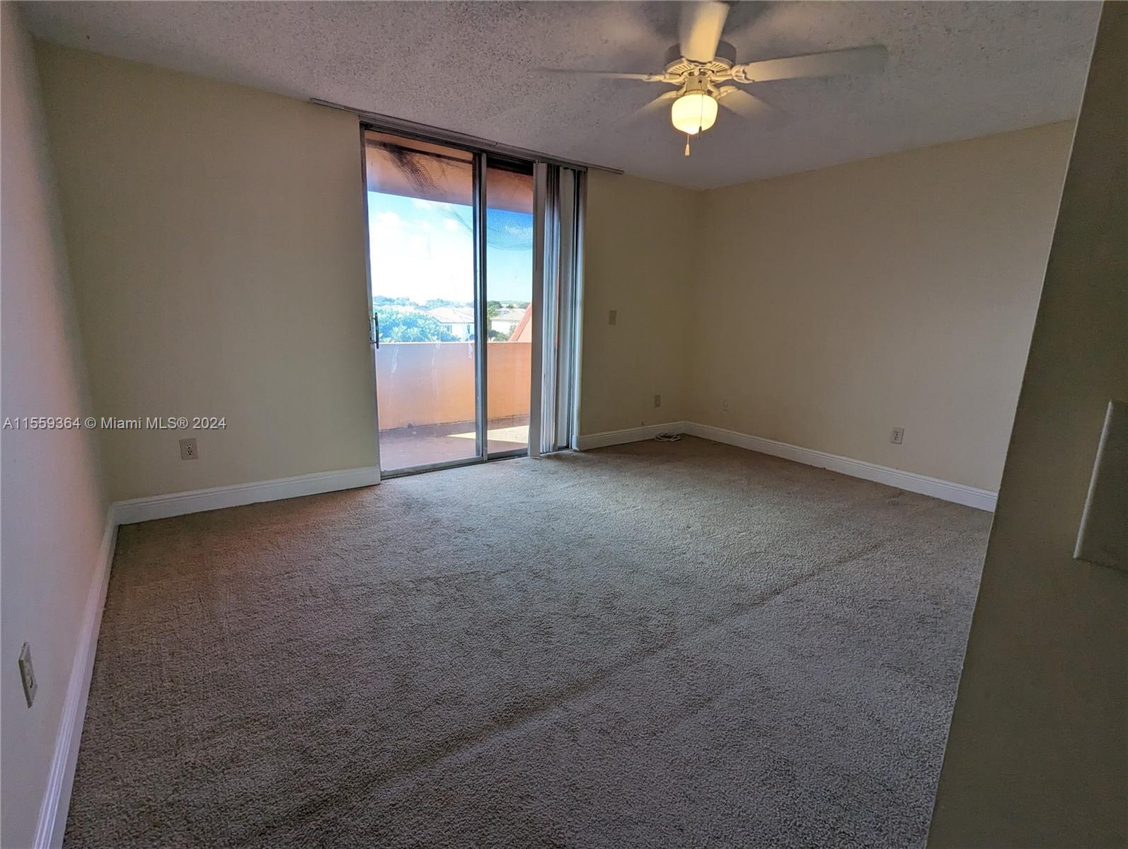 3490 Foxcroft Road, Unit B310 Miramar, FL 33025 - Photo 16 of 34 an empty room with closet and fan