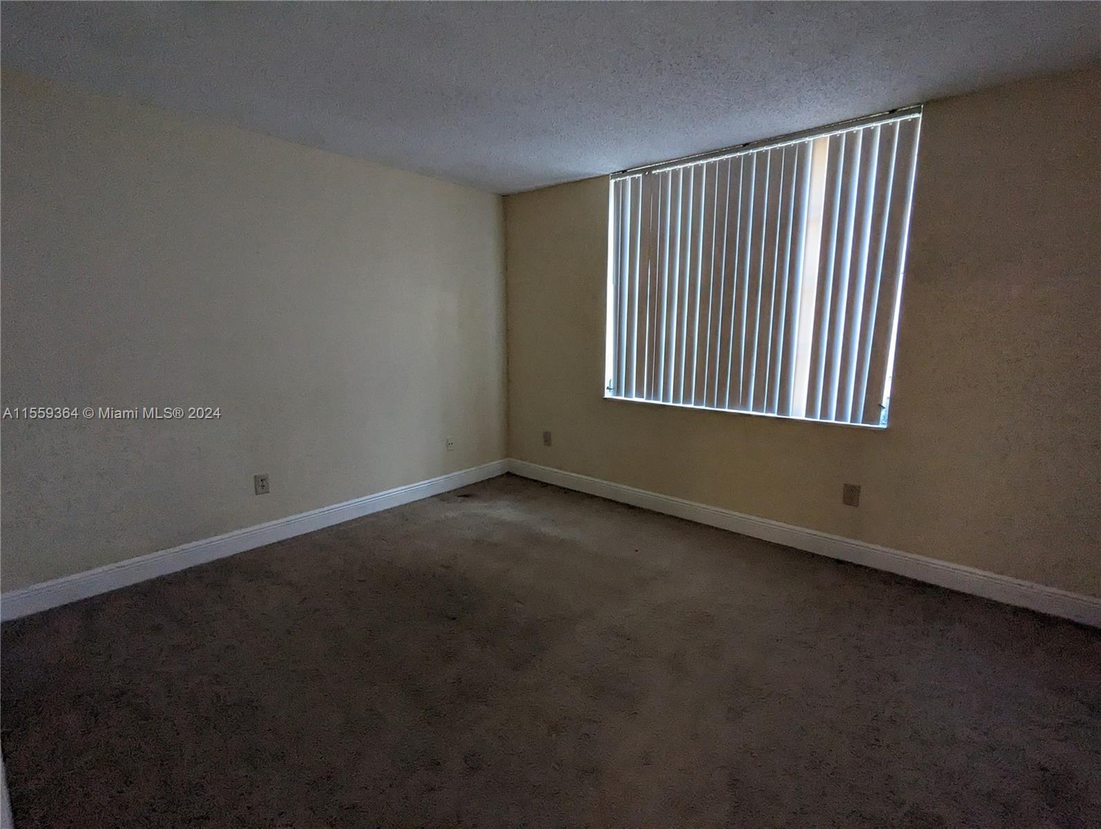 3490 Foxcroft Road, Unit B310 Miramar, FL 33025 - Photo 24 of 34 an empty room with a window
