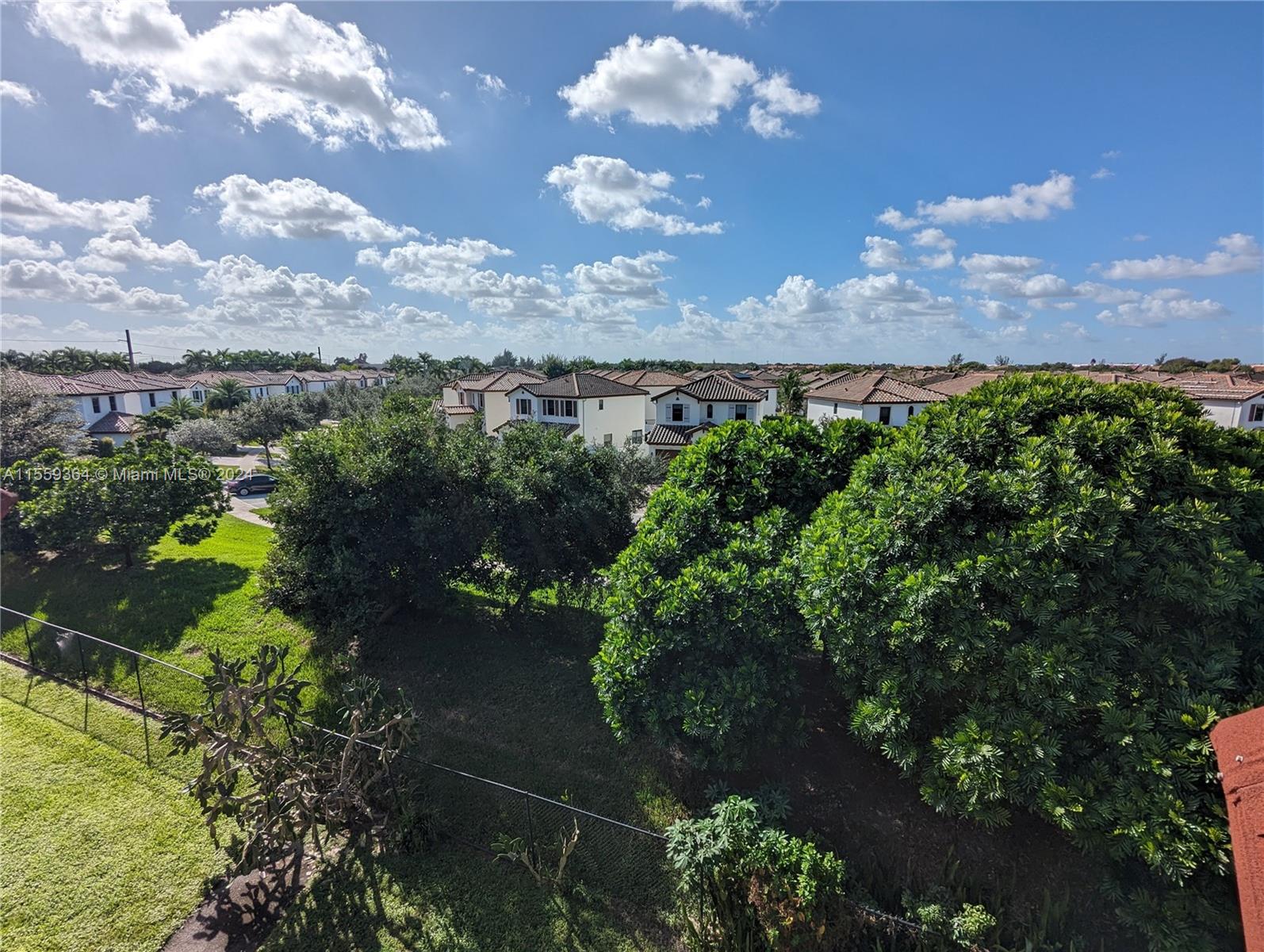 3490 Foxcroft Road, Unit B310 Miramar, FL 33025 - Photo 27 of 34 a view of a houses with a yard