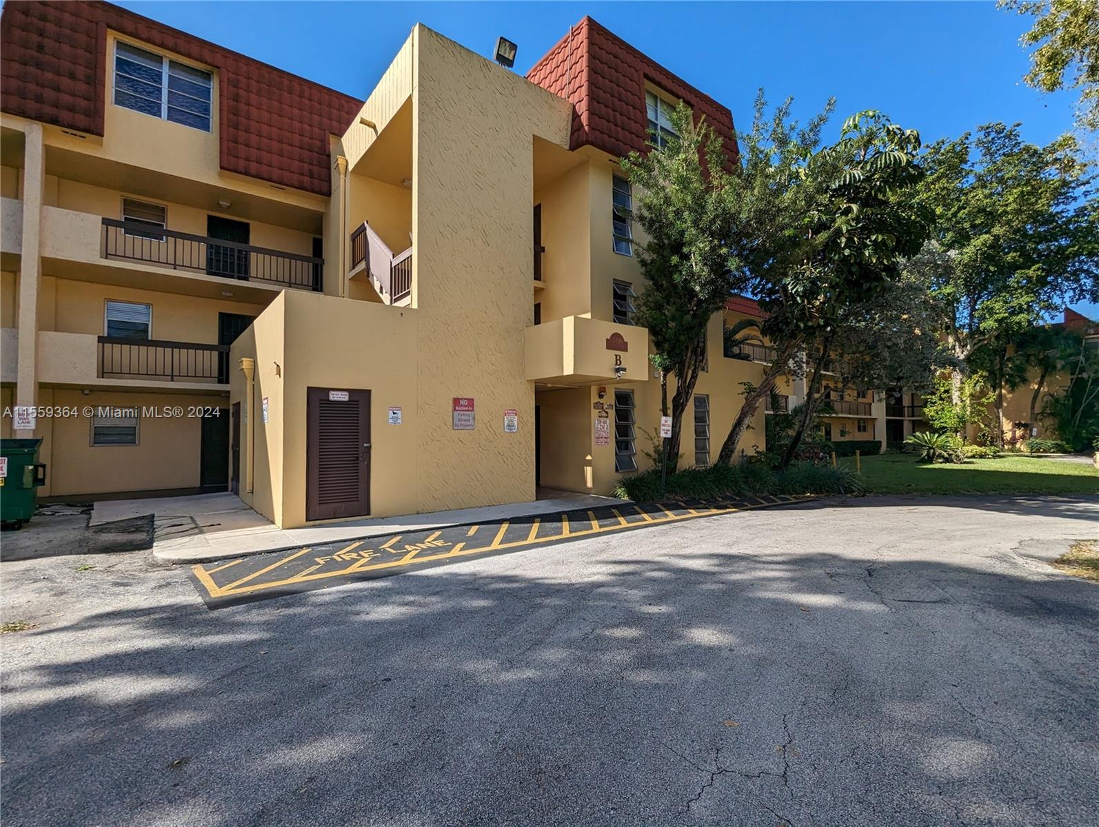 3490 Foxcroft Road, Unit B310 Miramar, FL 33025 - Photo 31 of 34 a view of a building with a street