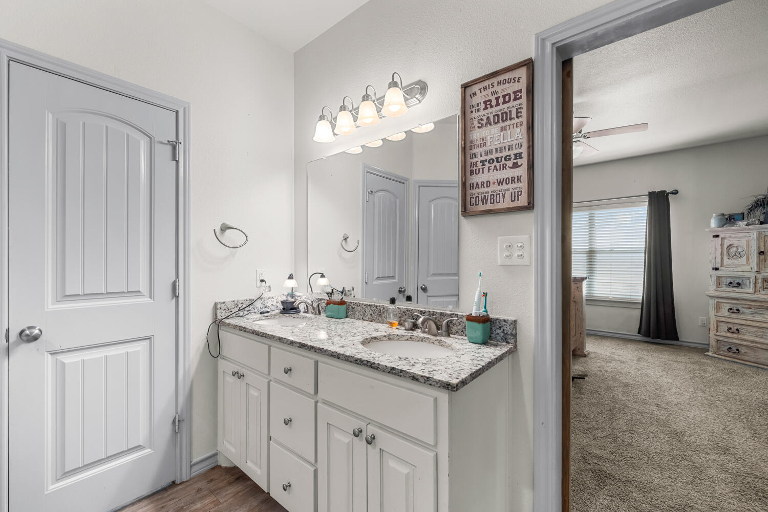 542 Nora Road Wilson, TX 79381 - Photo 12 of 42 a bathroom with a sink and a mirror