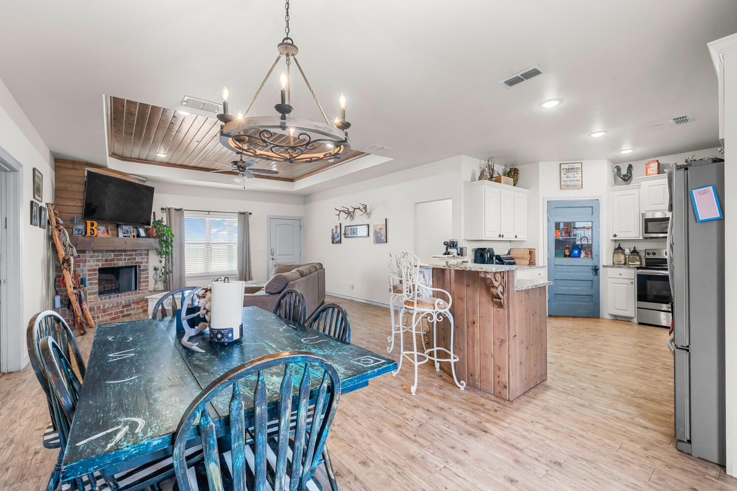542 Nora Road Wilson, TX 79381 - Photo 20 of 42 a view of a dining room with furniture window and wooden floor