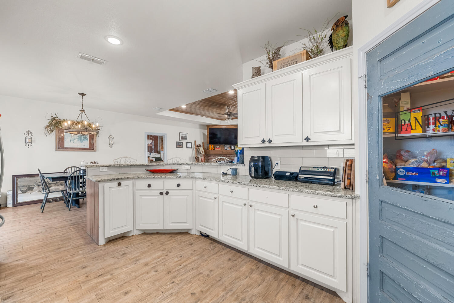 542 Nora Road Wilson, TX 79381 - Photo 22 of 42 a kitchen with appliances a sink and cabinets
